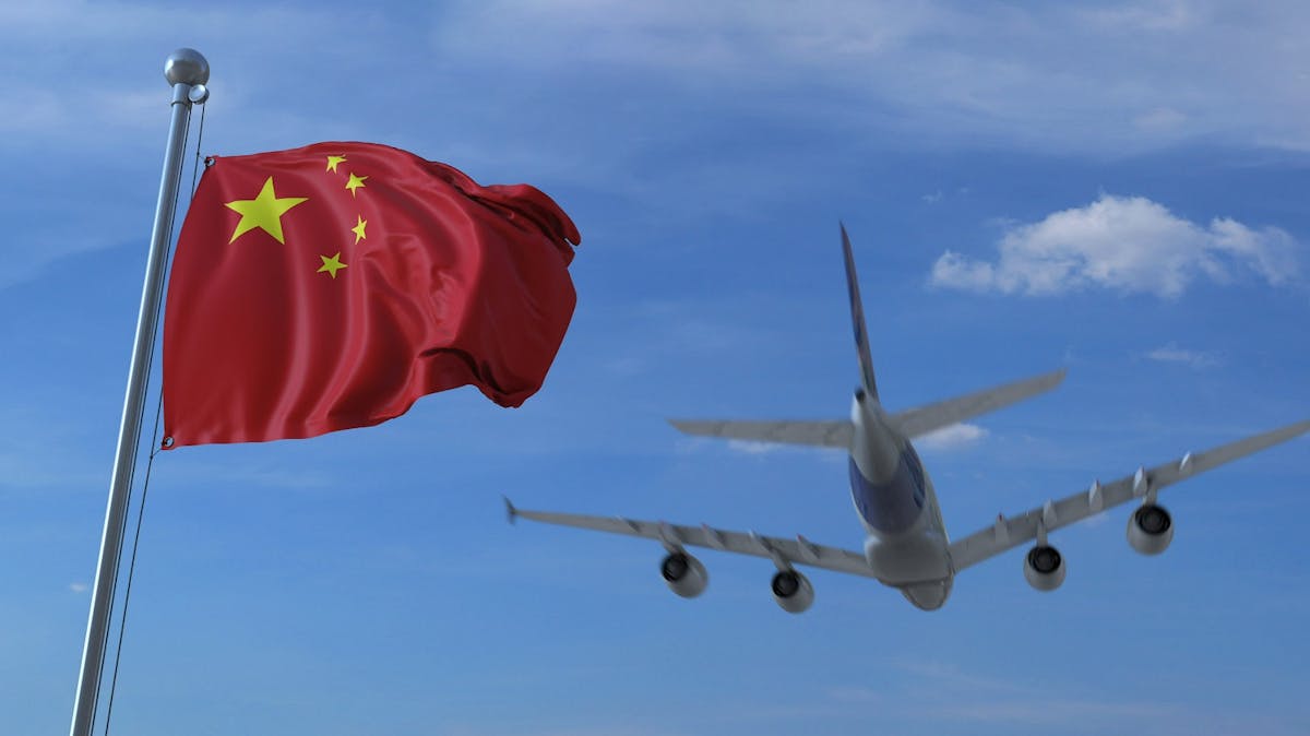 Chinese Flag and Commercial Plane